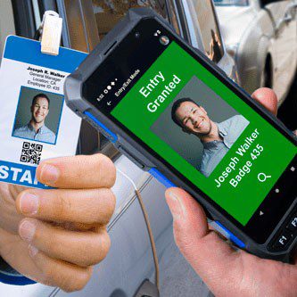 A person holding a smartphone displaying "entry granted" alongside an id badge for joseph p. walker.